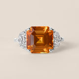 Orange Sapphire and Diamond Three-Stone Ring